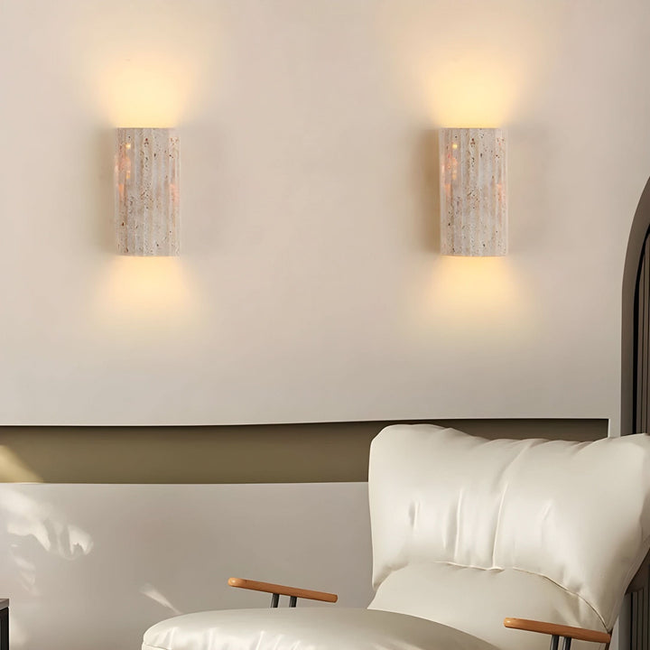 Modern indoor wall sconce, warm white LED, unique textured design. Enhances home ambiance.