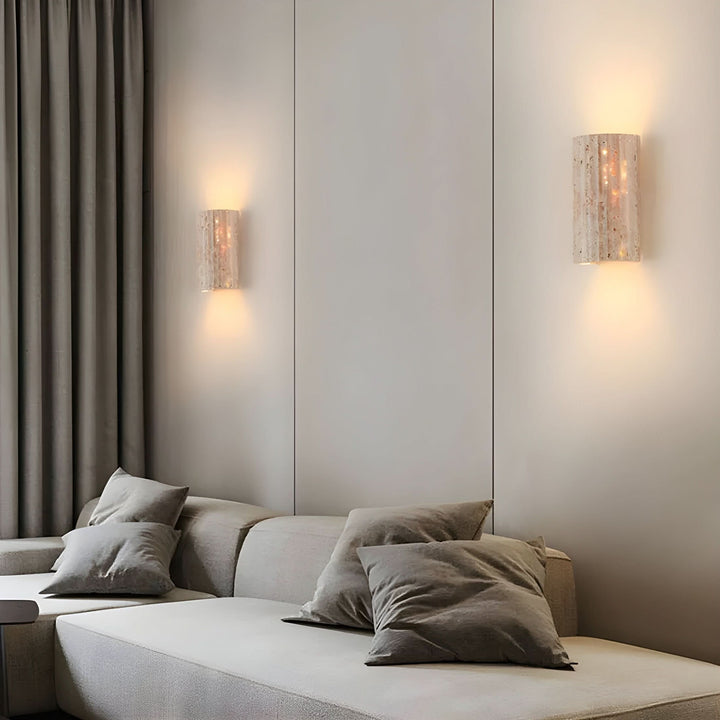 Energy-efficient indoor wall sconce with a distinctive textured surface and warm LED.