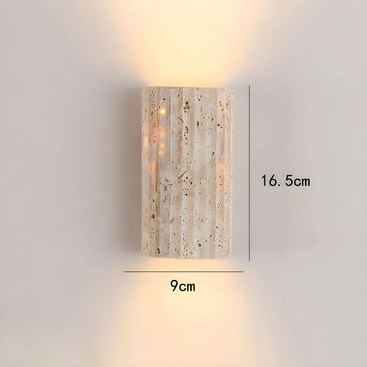 Warm white LED indoor wall sconce, unique textured modern design for ambient home lighting.