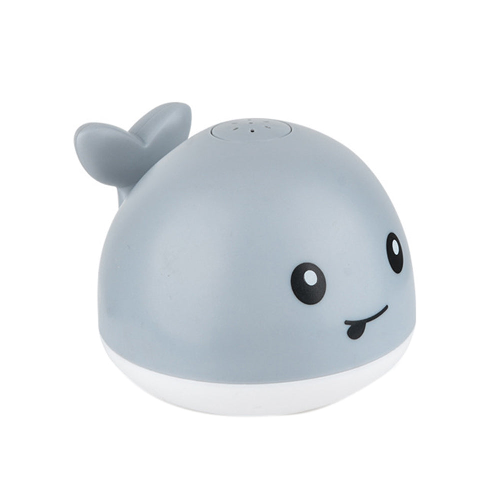 Interactive baby whale bath toy with flashing LED lights, musical fountain, & water spray for sensory bath time fun.