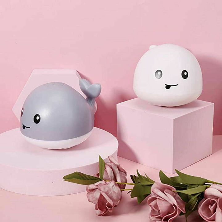 Baby's Flashing Water Whale bath toy. Musical fountain with LED lights creates a fun, splashy, interactive bath experience.