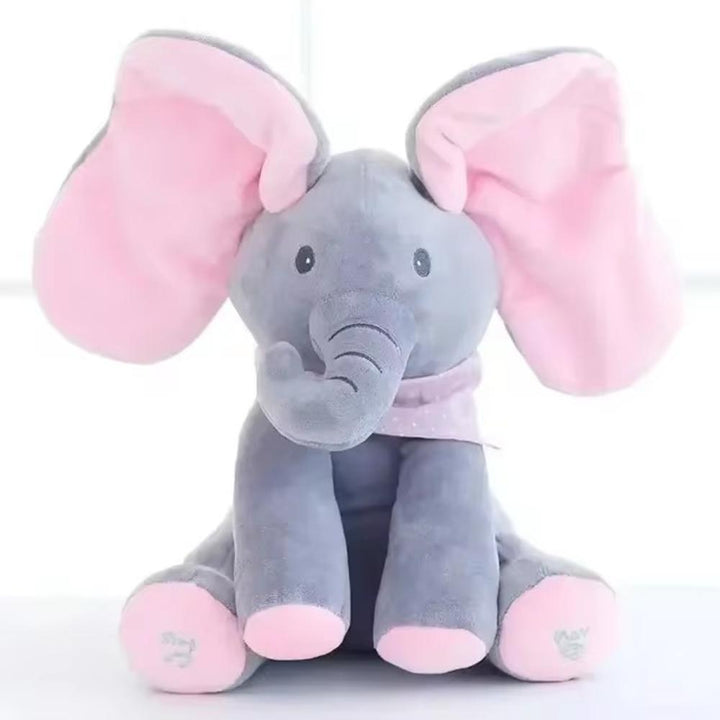 Cute gray elephant plush toy with big ears playing peek-a-boo, an interactive talking stuffed animal for kids.