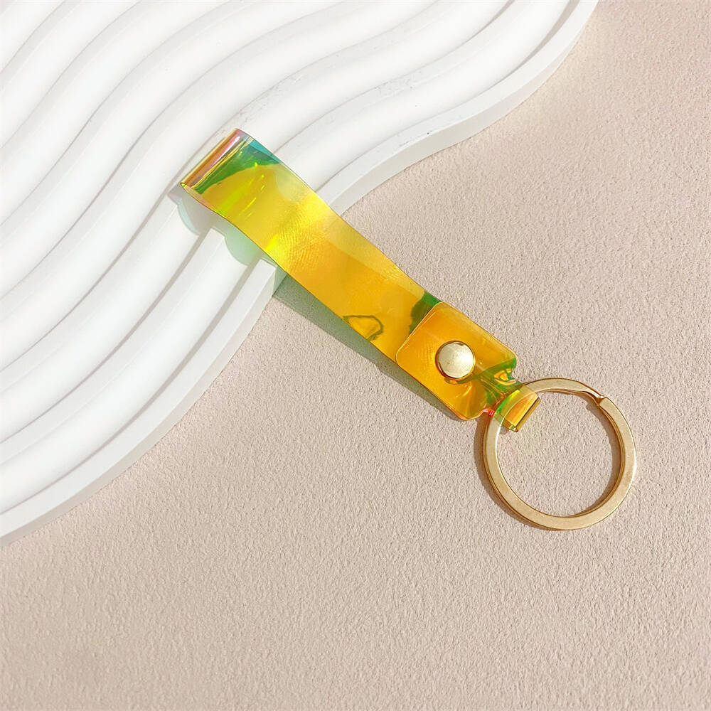 Eye-catching iridescent acrylic bag charm, a vibrant and colorful accessory.