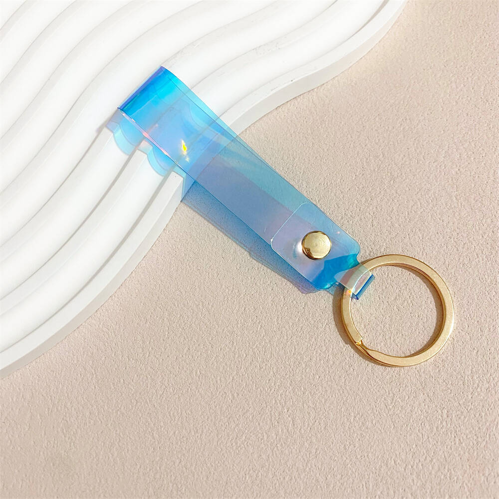 Fashionable iridescent acrylic key holder, a vibrant and colorful accessory.