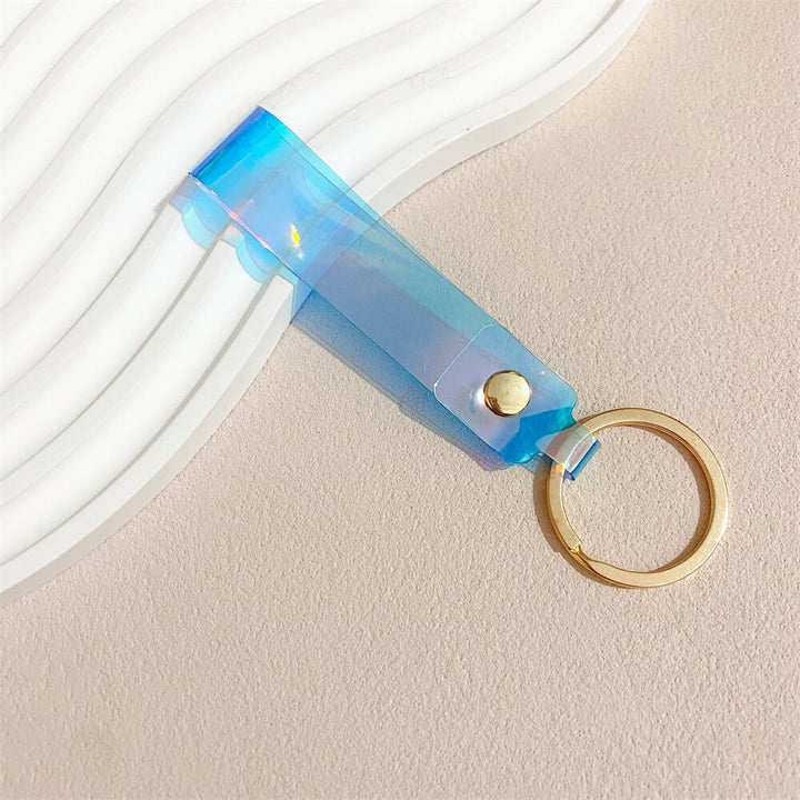 Fashionable iridescent acrylic key holder, a vibrant and colorful accessory.