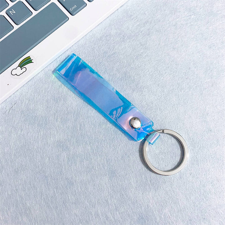 Rainbow-effect iridescent acrylic keychain, a vibrant and colorful bag charm.