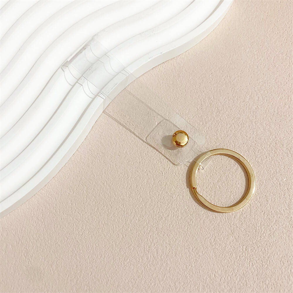 Light-catching iridescent acrylic key holder, a stylish and colorful accessory.