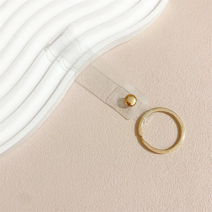 Light-catching iridescent acrylic key holder, a stylish and colorful accessory.