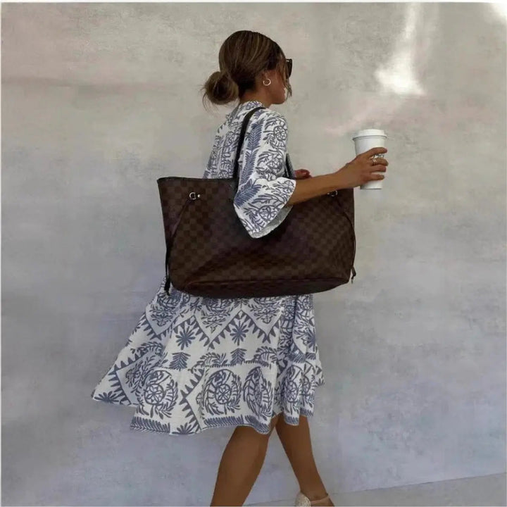 Elegant Isla women's loose fit floral dress with botanical print. A comfortable tunic for summer days and casual wear.