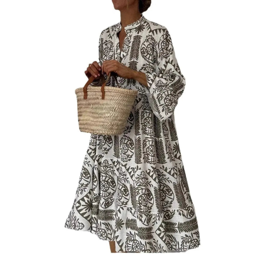 Loose fit floral tunic dress for women. The Isla botanical print summer dress features a comfortable tiered hem.