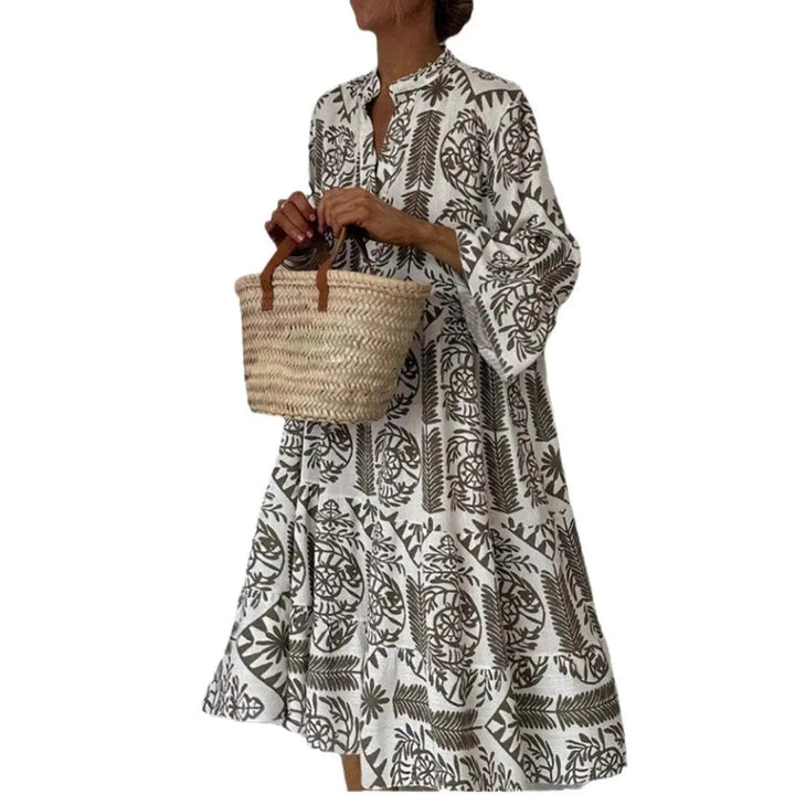 Loose fit floral tunic dress for women. The Isla botanical print summer dress features a comfortable tiered hem.