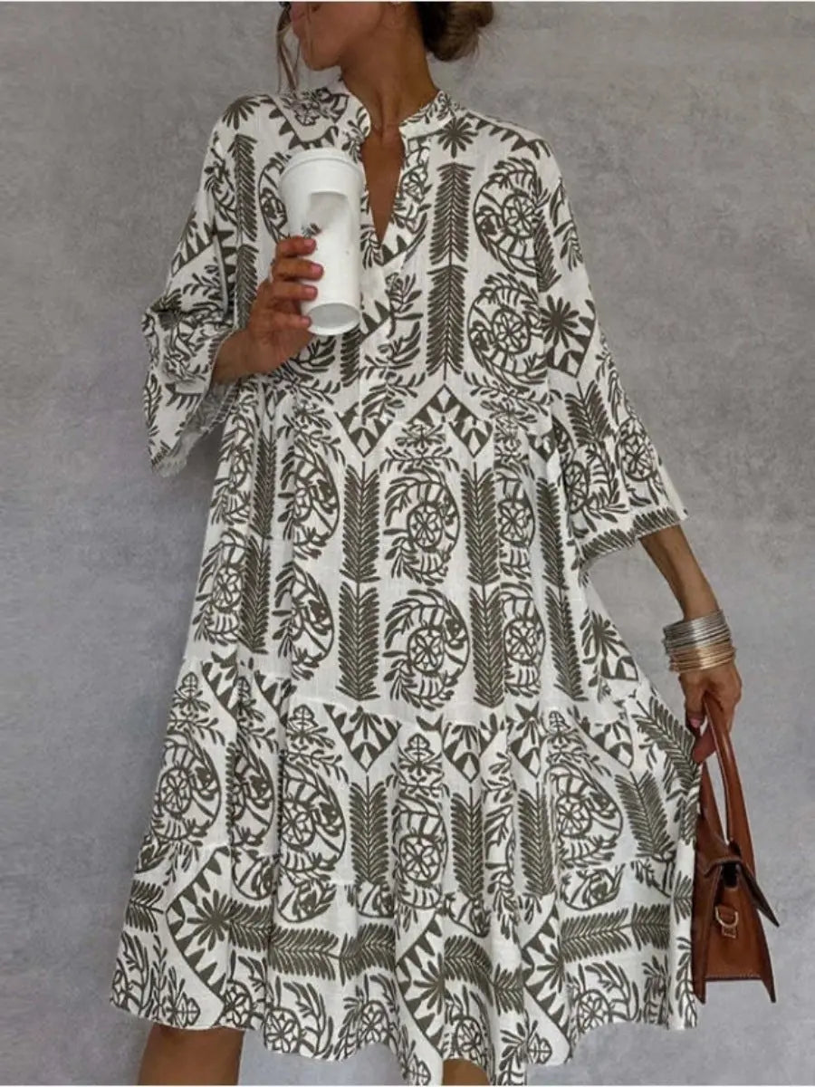 Stylish women's floral print tunic dress, loose fit, tiered hem. A perfect summer dress or beach cover-up for warm weather.