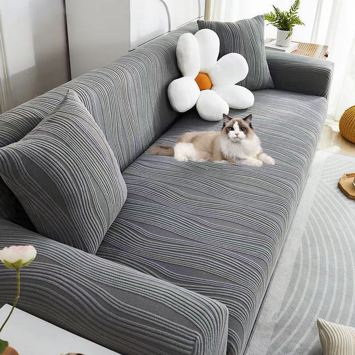 Jacquard sofa cover for living room, stretch fit & pet-friendly, protecting furniture from scratches.