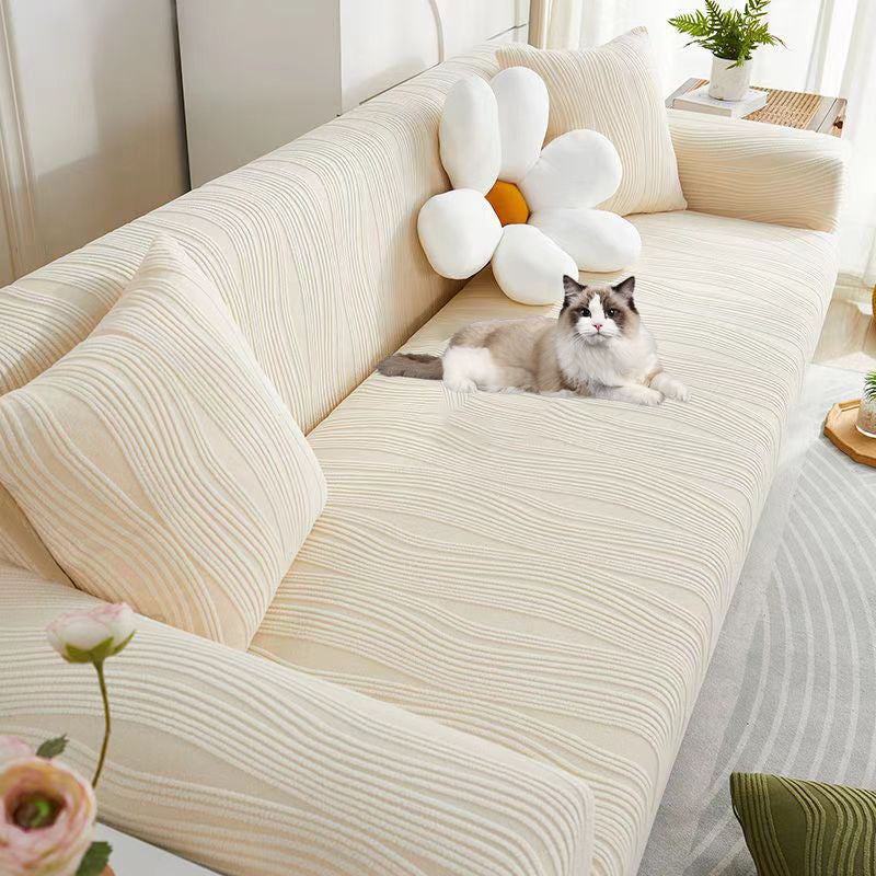 Washable jacquard sofa cover, easy-to-install, offering pet-friendly protection for living rooms.