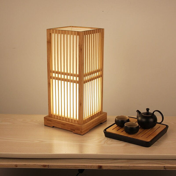Japanese Tatami style table lamp with bamboo shade. Zen decor for natural lighting & bedside accent.