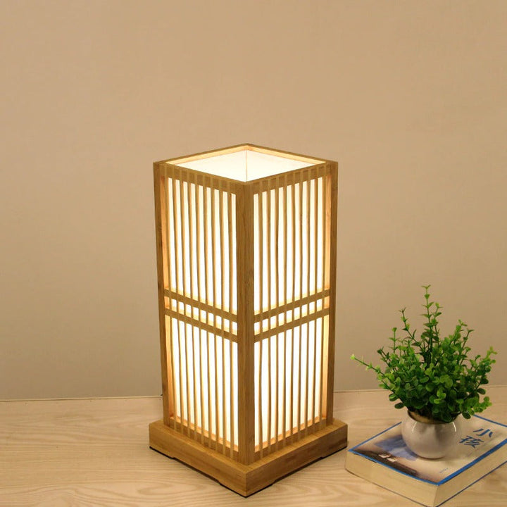 Tatami style table lamp, ideal bedside light. Bamboo shade offers soft, natural lighting for home accent.
