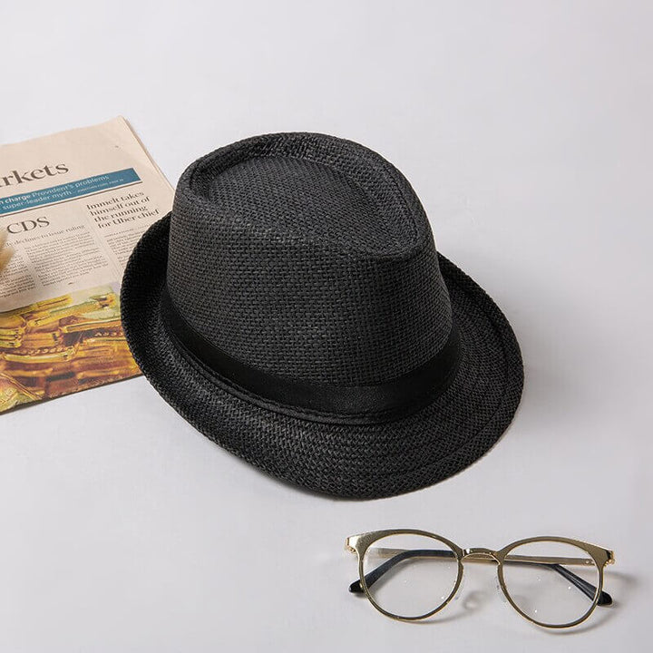 Black lightweight classic trilby summer hat, a versatile unisex accessory for any sunny occasion.