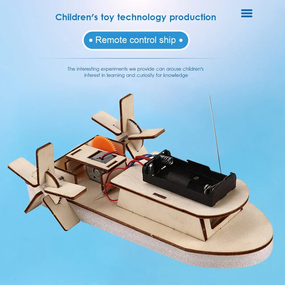 Young boy proudly holding his finished DIY wooden electric toy boat. Educational STEM gift.