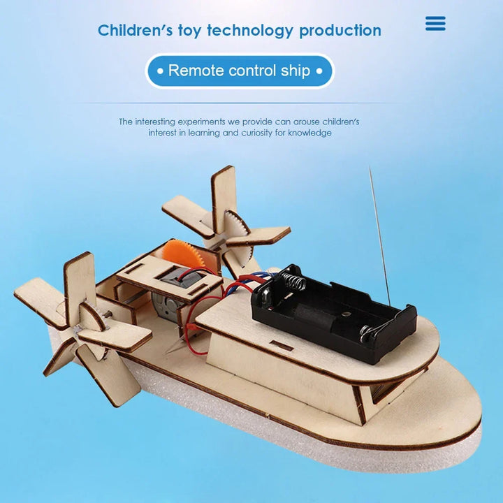 Young boy proudly holding his finished DIY wooden electric toy boat. Educational STEM gift.
