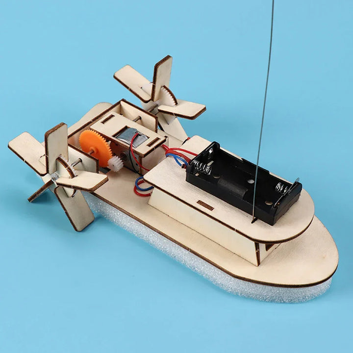 Kids' DIY wooden electric toy boat floating. Fun, educational STEM building kit for children.