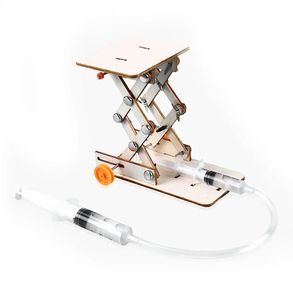 Excited child unwrapping a wooden electric toy boat building kit. Perfect educational gift.