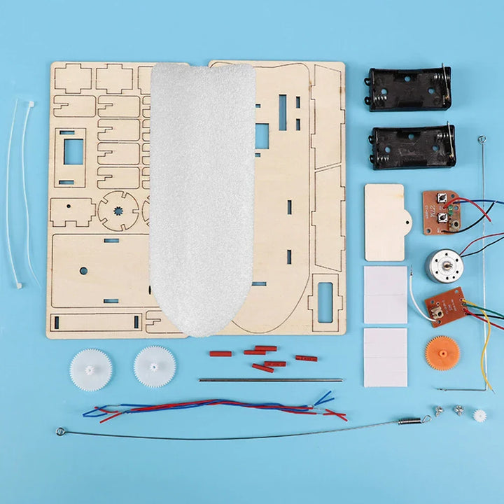 Child hands carefully assembling wooden electric boat. Educational DIY STEM project for kids.