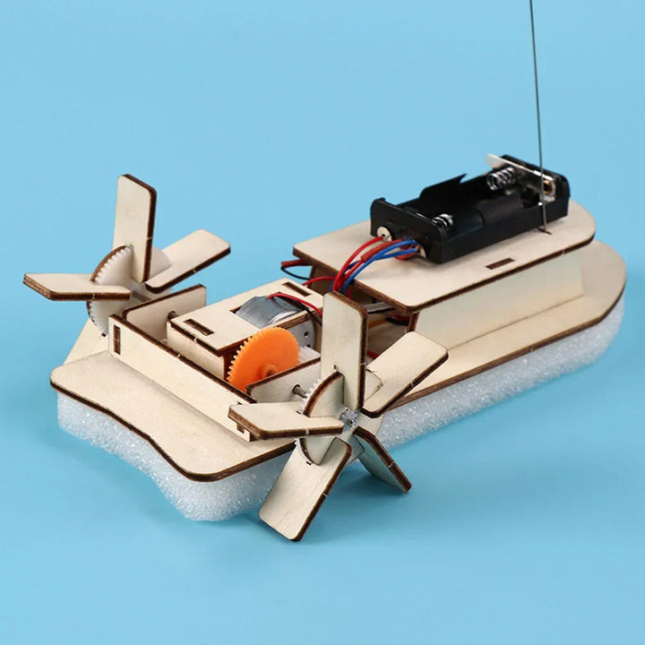 Finished electric toy boat made from a kids' wooden DIY kit. Fun science and building project.