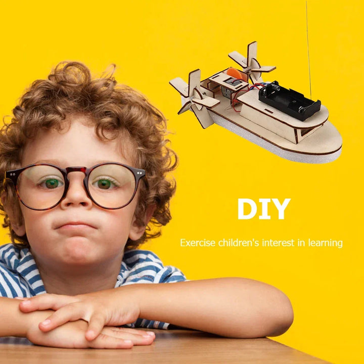 Unboxed wooden DIY electric boat kit components. Educational STEM project for young builders.
