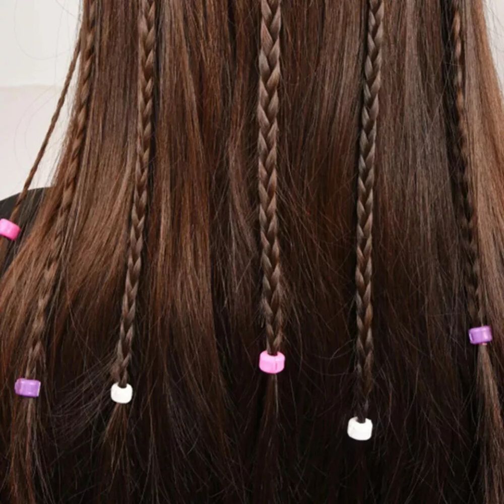 Child using an automatic hair braider to create perfect braids. Innovative kids' hair styling tool.