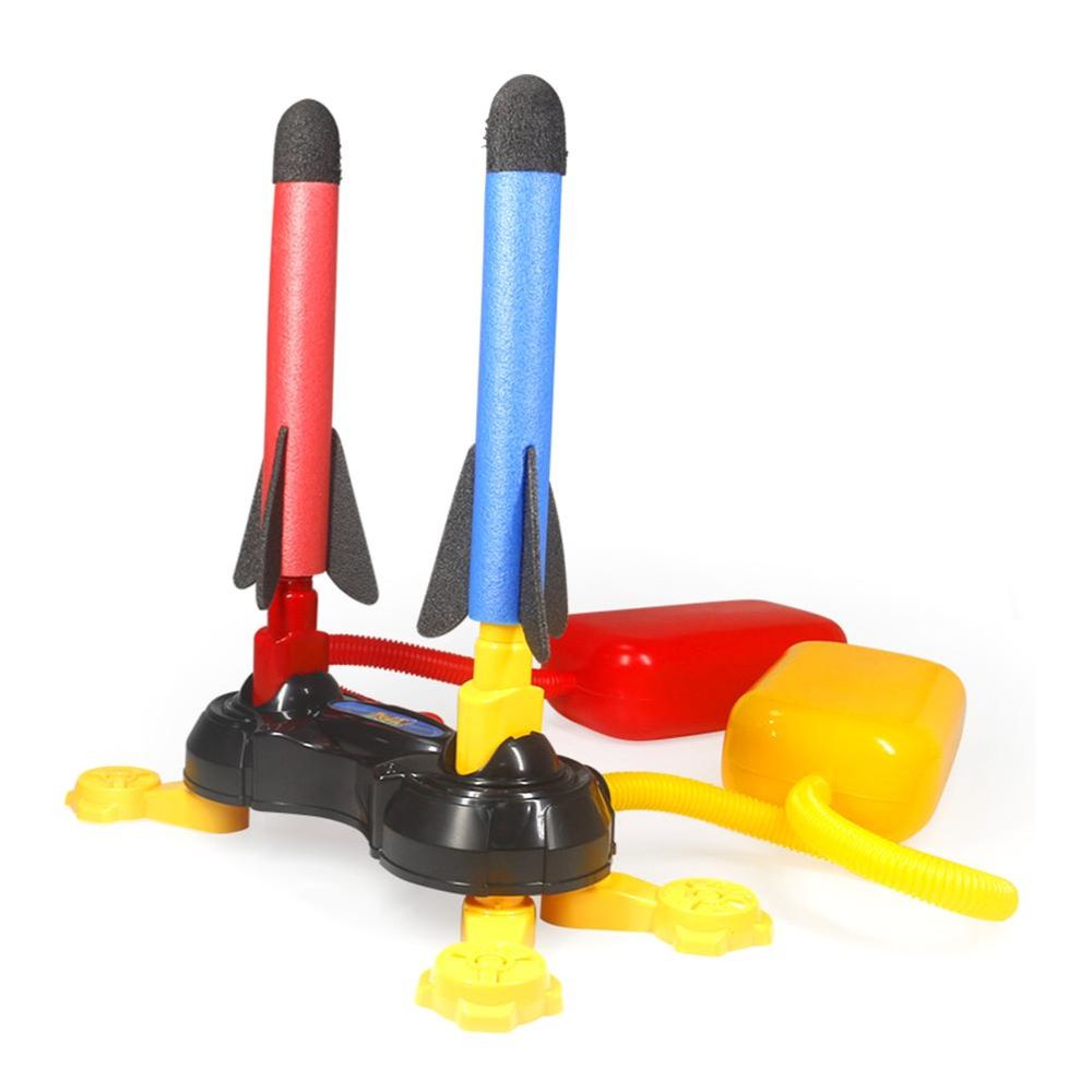 Kids launching a stomp rocket high into the sky, showcasing outdoor fun and active play. Great STEM toy.