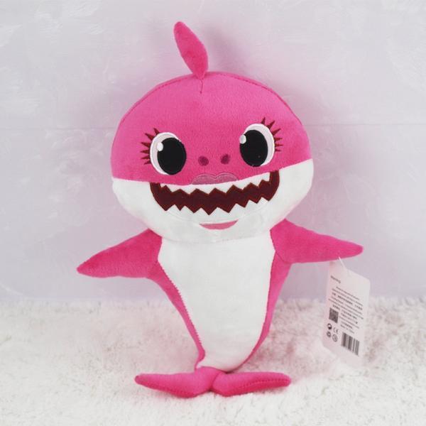 Soft Baby Shark singing plush toy. Cuddly stuffed animal with sound, a fun musical gift for kids.