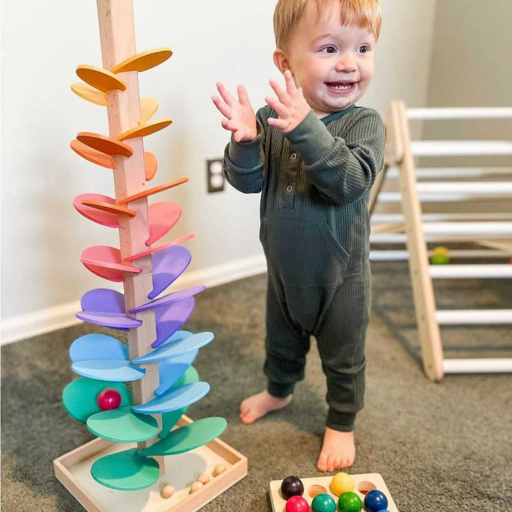Kids' wooden rainbow sound tower for sensory play; developmental musical toy for toddlers & infants.