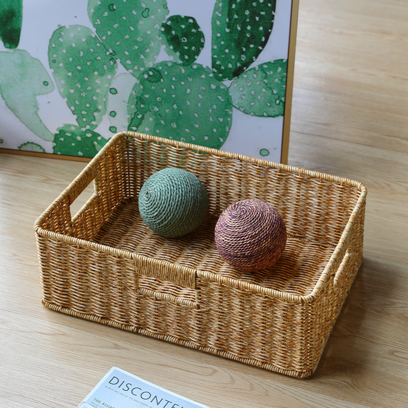 Decorative large rectangular wicker basket for bedroom storage.