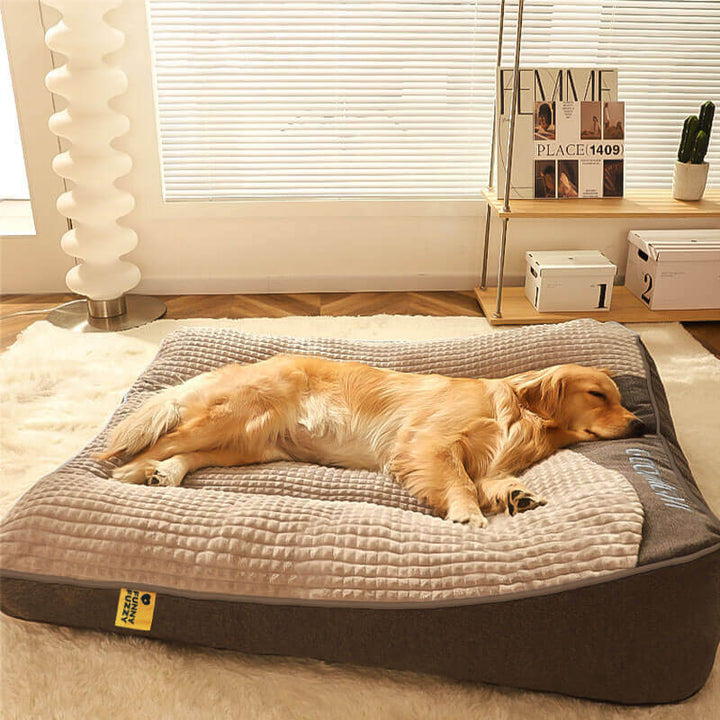 Luxury large memory foam dog bed with a soft velvet headrest, providing ultimate comfort and joint support.