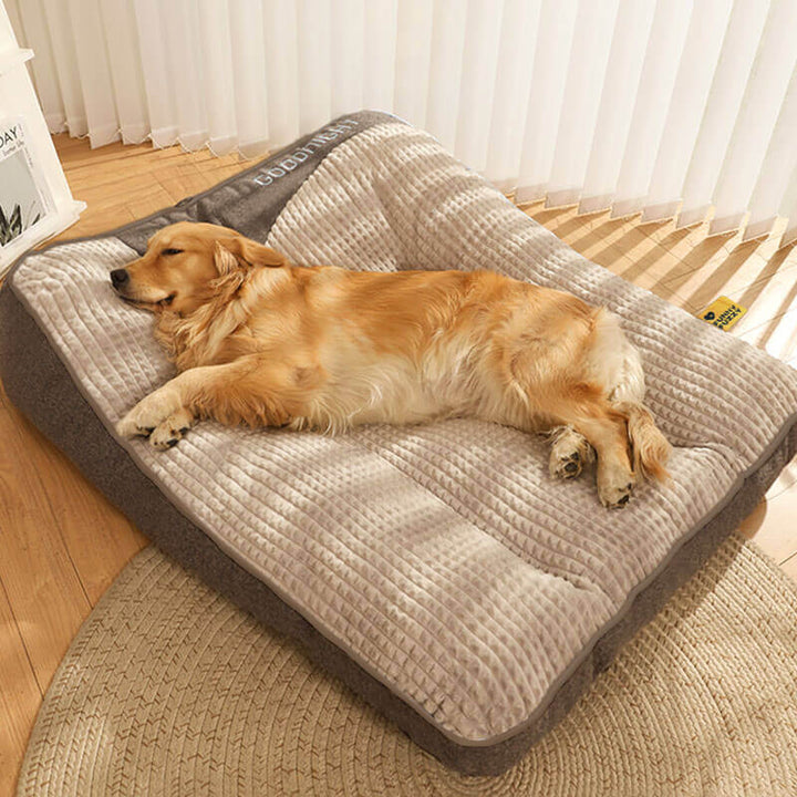 Orthopedic dog cushion for large dogs, featuring memory foam for superior joint support and a cozy headrest.