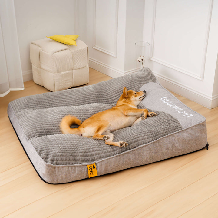 Soft velvet orthopedic dog bed with a high-density memory foam base and a comfortable headrest for pets.