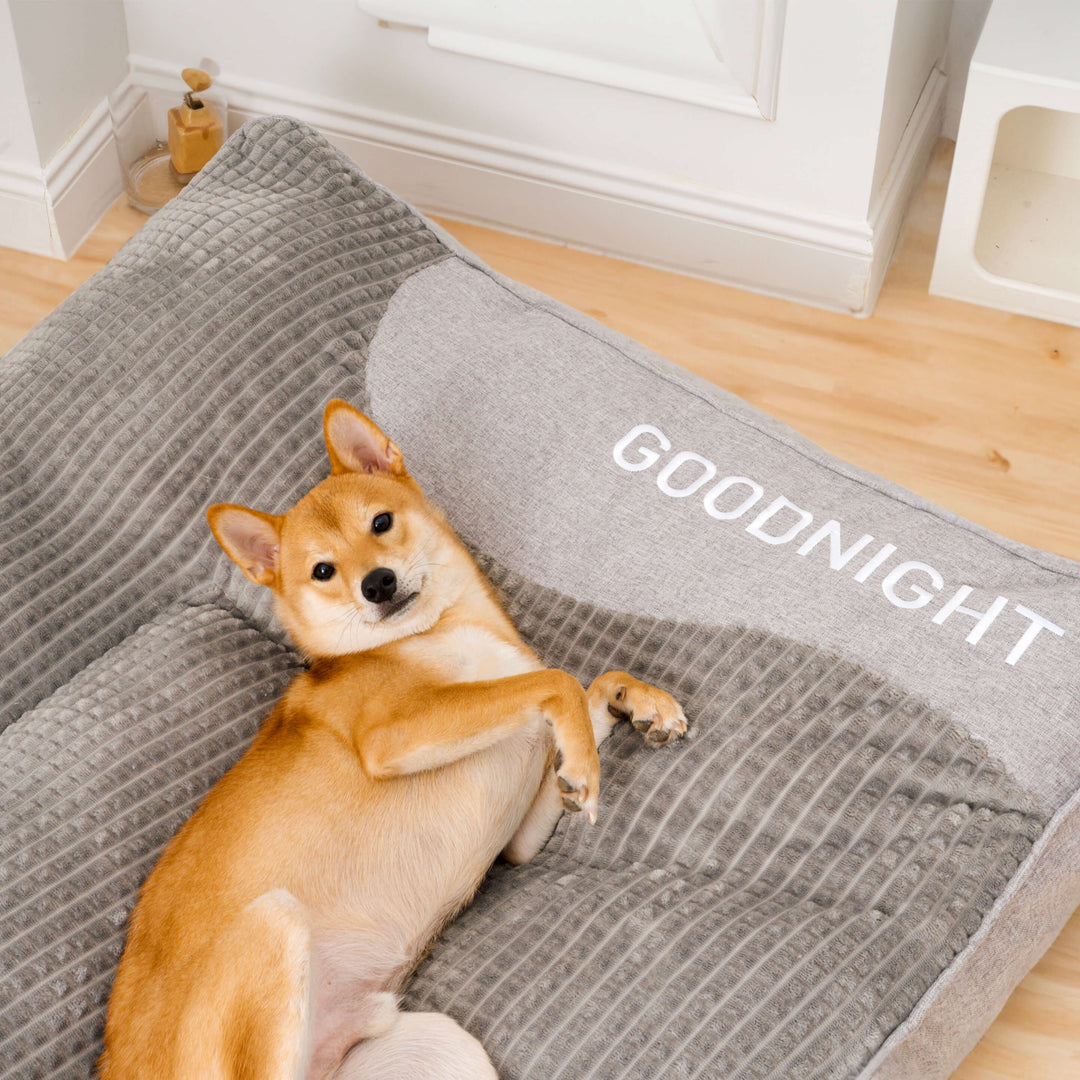 Luxury memory foam dog bed with headrest and joint support, perfect for large dogs needing orthopedic comfort.