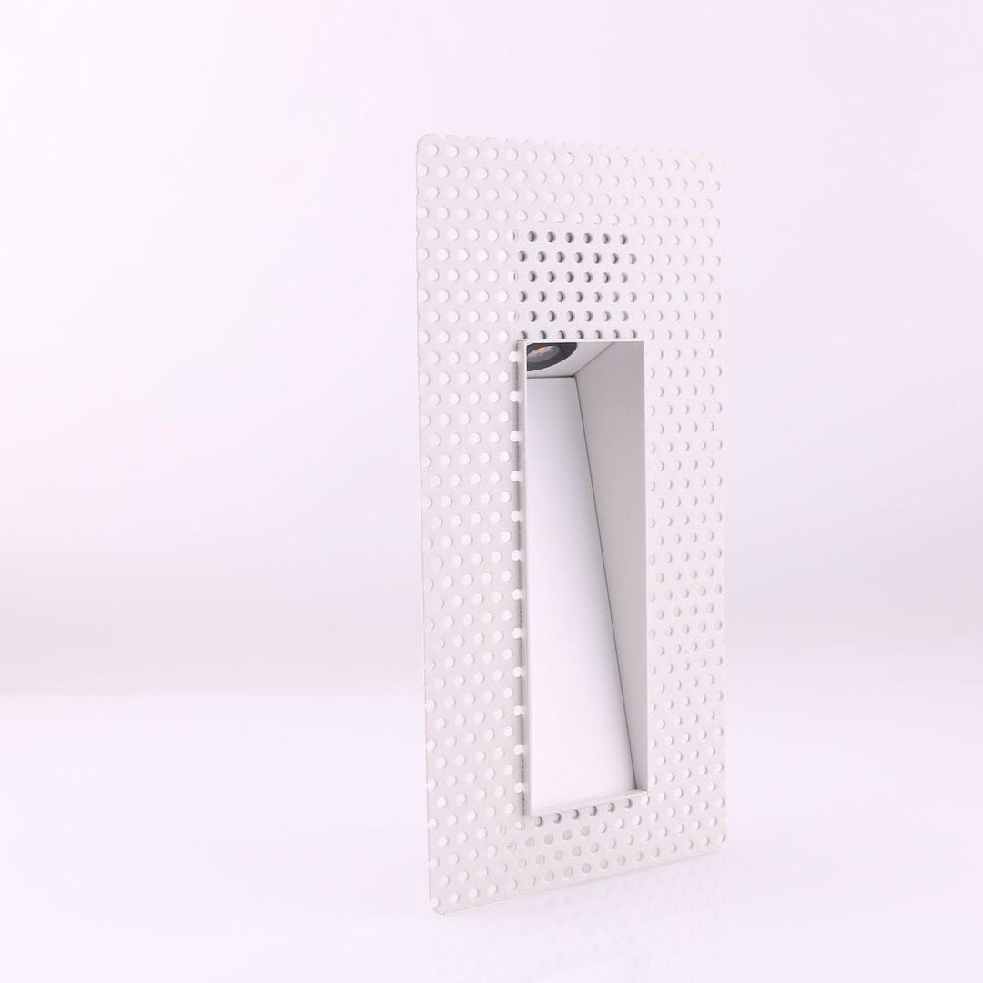 Square LED recessed step light with motion sensor for modern homes.