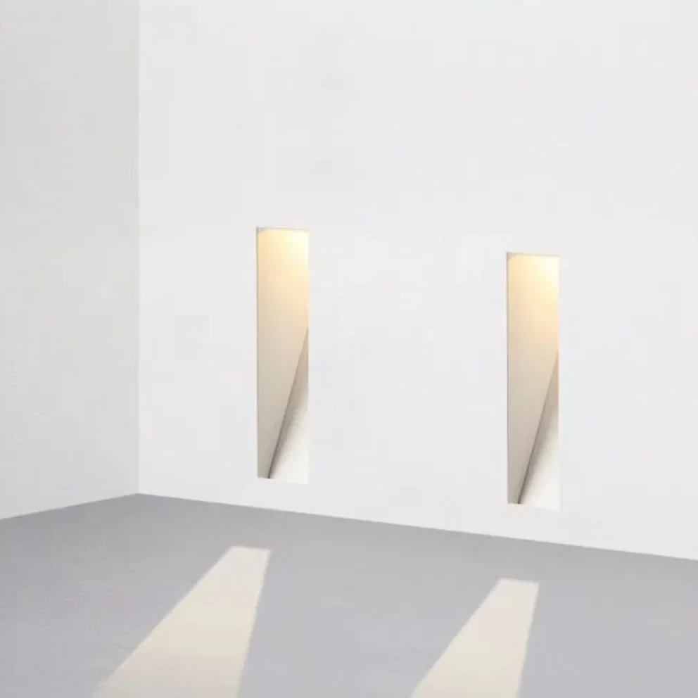 Sleek LED recessed guide light for stairways, enhances home safety.