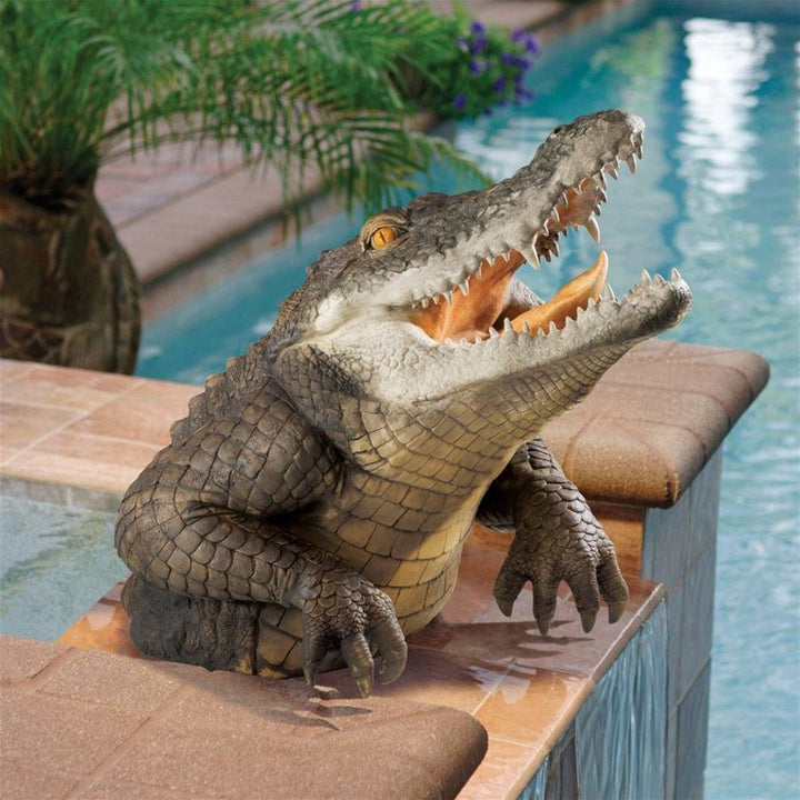 Detailed close-up of lifelike resin alligator garden statue, perfect lawn or pond decor.