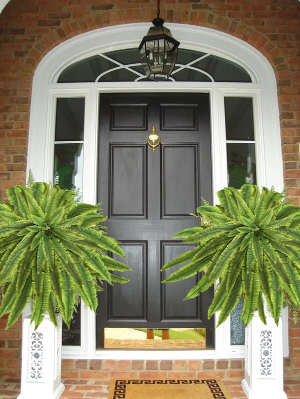Vibrant UV-resistant artificial Boston fern for outdoor garden and home decoration.