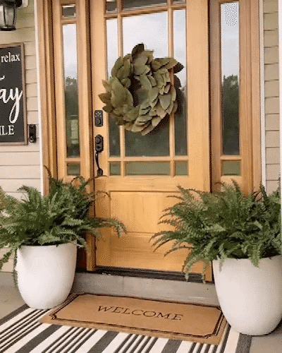 Faux Boston fern, lifelike and UV-protected, perfect low-maintenance greenery for patios.