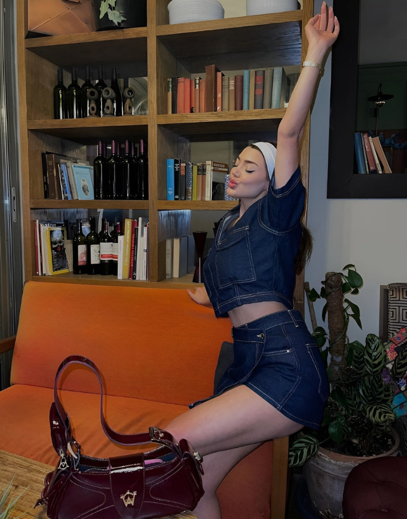 Women's trendy dark blue denim skort and top set. Versatile two-piece for spring & summer fashion.
