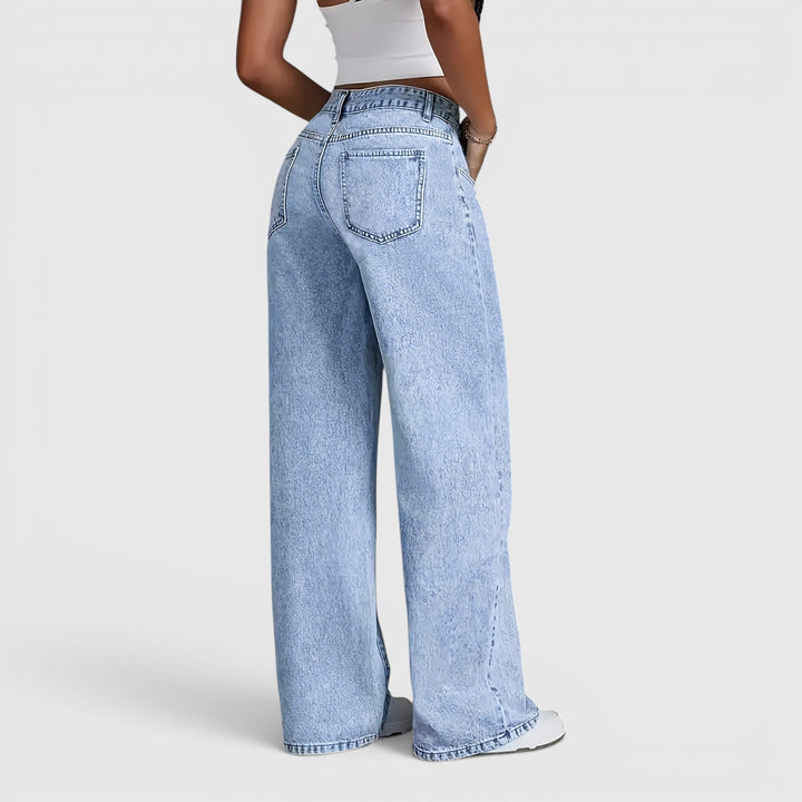 Comfortable women's high waist wide-leg jeans. Light blue oversized baggy fit for versatile travel & workwear.