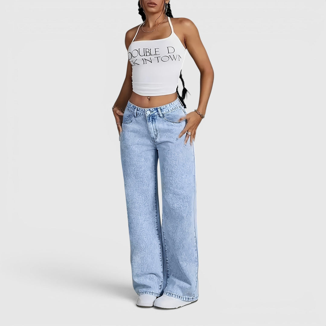 Relaxed fit women's oversized high-waist jeans. Light blue wide-leg casual trousers for versatile travel & everyday style.