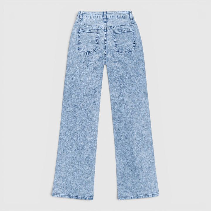 Women's light blue baggy high-waist jeans. Oversized wide-leg comfortable travel pants and casual workwear.