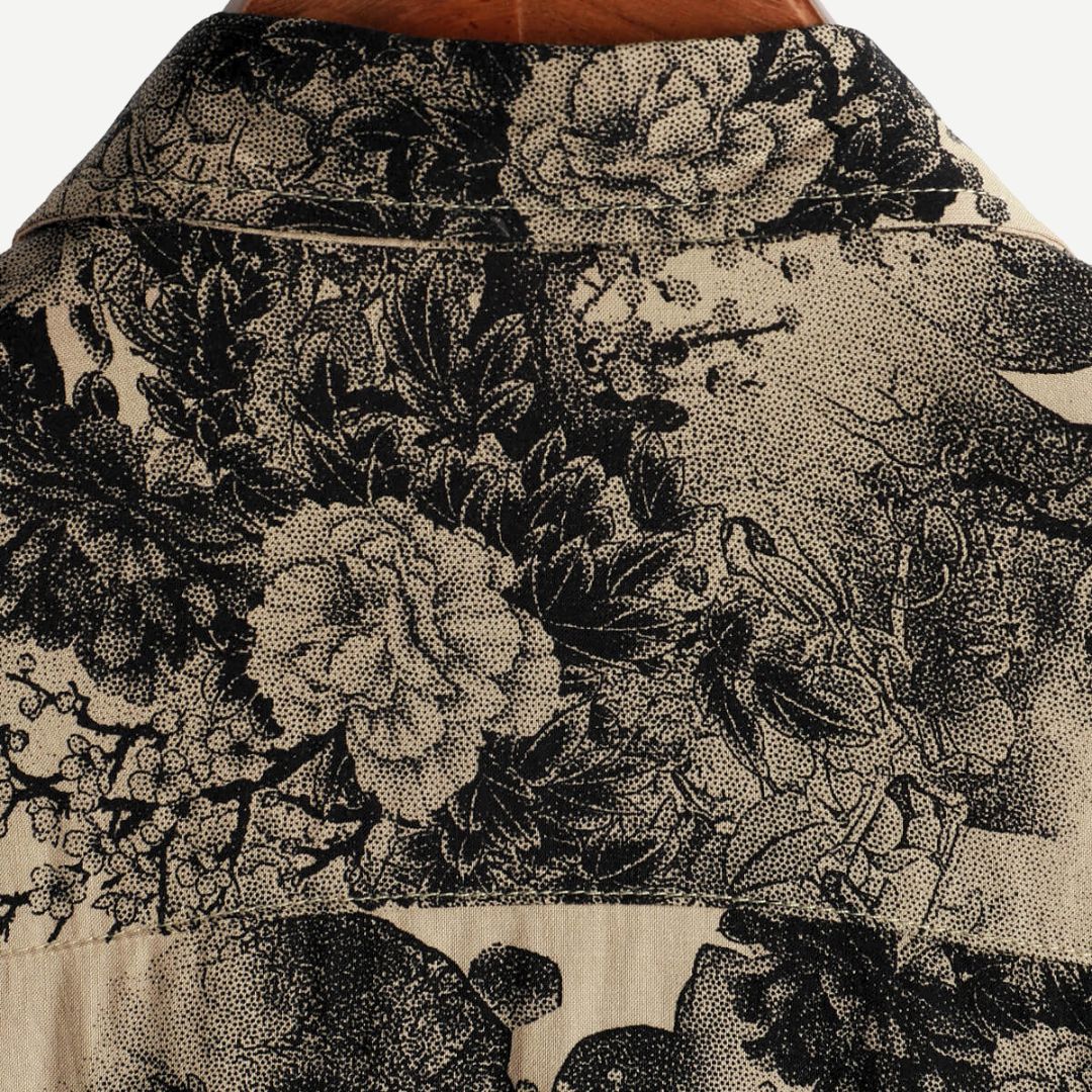 Vibrant men's patterned short sleeve shirt with a floral design, perfect for summer casual outings.