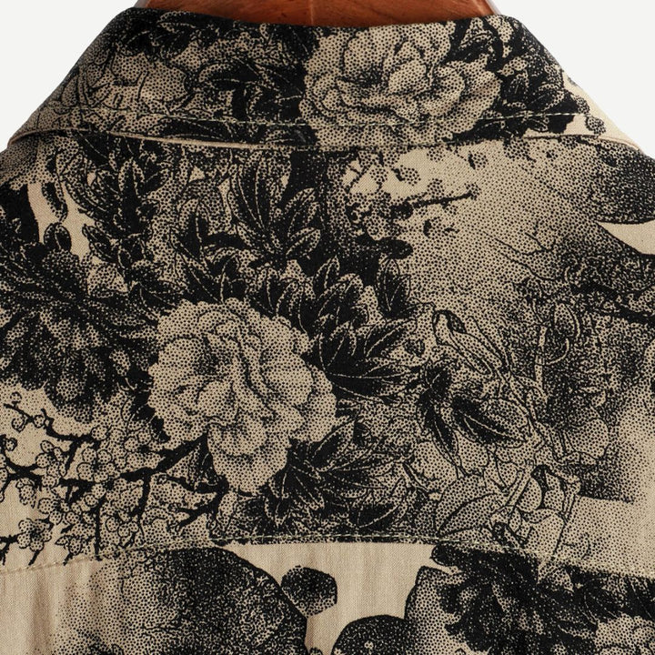 Vibrant men's patterned short sleeve shirt with a floral design, perfect for summer casual outings.