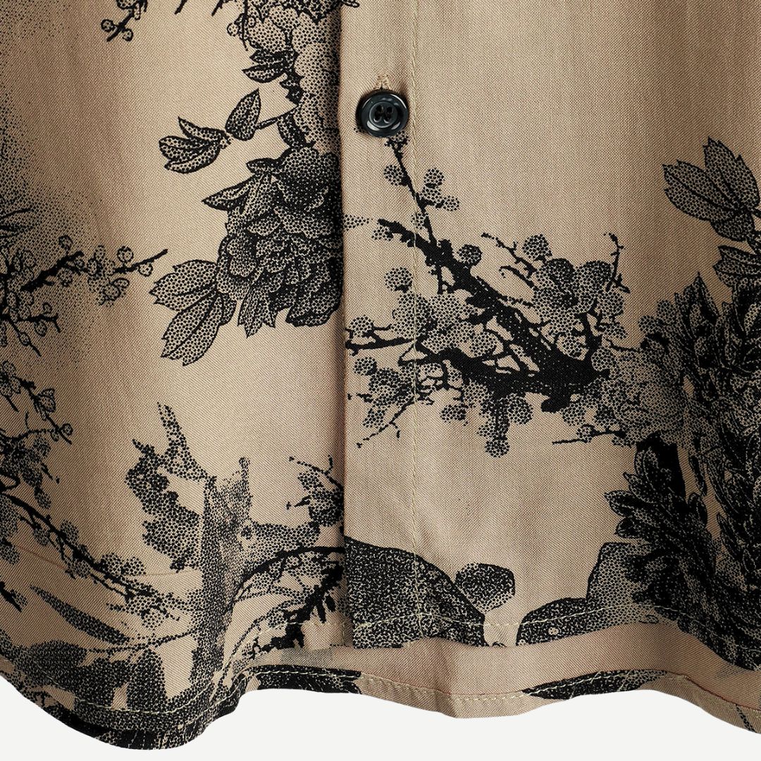Breathable men's floral print short sleeve shirt, an essential lightweight top for summer beach days.