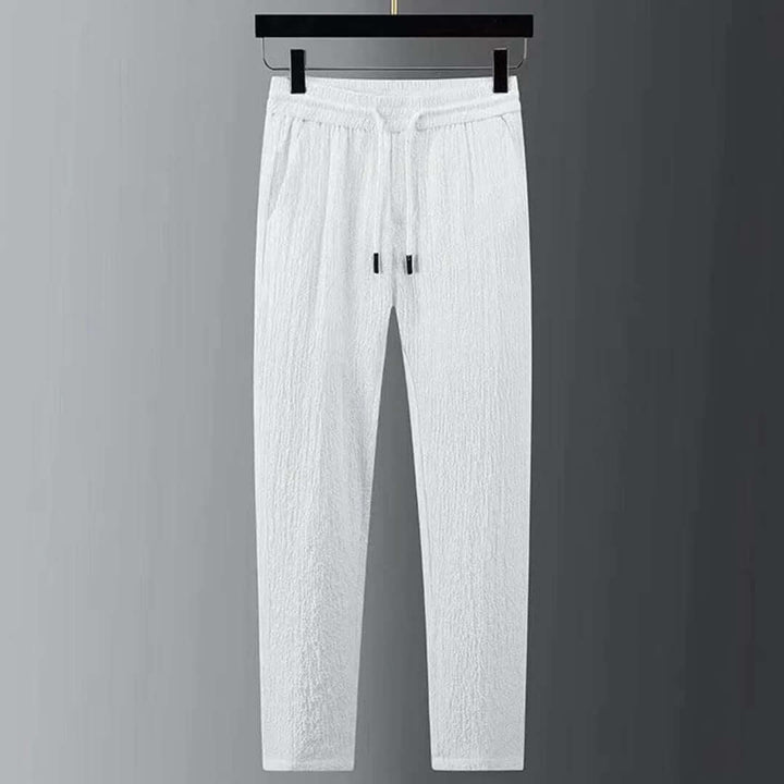 White men's lightweight summer two-piece set, offering modern style and comfortable casual fashion.